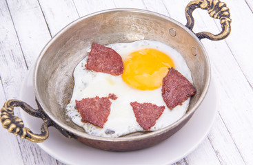 Frying eggs with sausage, Turkish Breakfast