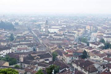 Fototapeta na wymiar Verona's cityscape early in the morning. Roofs and buildings of the old Italian city.