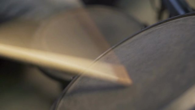 Drum sticks beating on an electric hi-hat cymbal and snare drum.