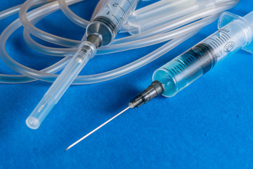 Syringe. Syringe on blue background