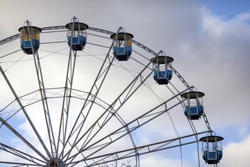 Tuinposter a Ferris wheel in an amusement park © Sergey