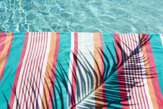 Poolside with colorful towel