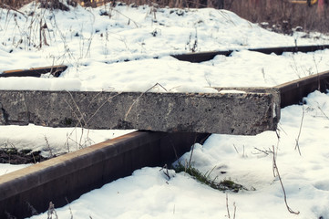 Snowbound rails, concrete block