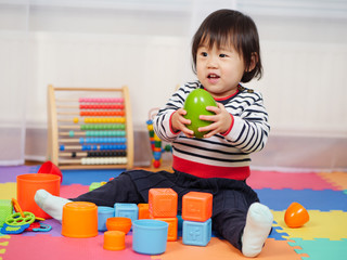 baby girl play toy at home