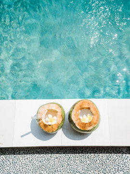 Two tropical cocktails in pool
