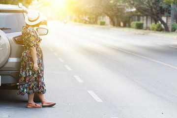 Woman parking car on the side of the road for repair