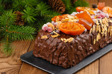 Traditional christmas fruit cake pudding in chocolate glaze