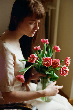 Pretty Woman Holding Bouquet Of Tulips