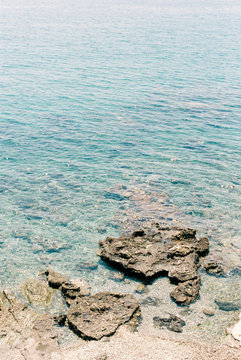 Rocks in Azur Blue Water