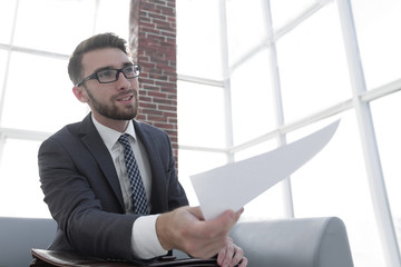 Image of business man holding paper