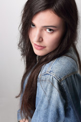 Portrait of beautiful young woman with black hair