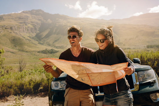 Young couple planning a hiking tour