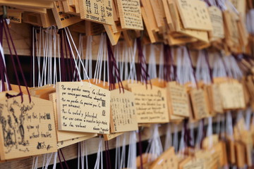 Detail of wishes written on the wooden boards called 