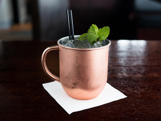 Moscow Mule on ice in traditional copper mug.