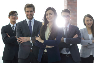 Attractive young business owner in office, folded hands  in fron