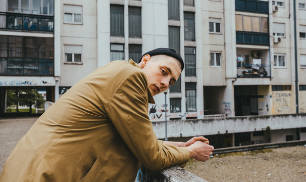 Portrait of young hip adoslecent guy /skinhead/punk/skate subculture.