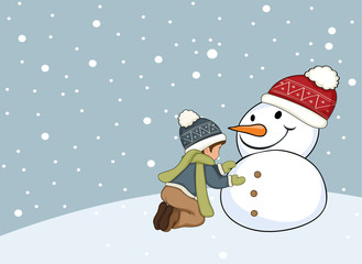 Boy making snowman