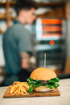 Burger with french frites in a restaurant.