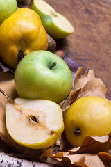 Autumn fruit background. Apple pear cinnamon the leaves of the oak tree. Thanksgiving seasonal fruit.