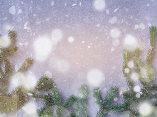 Natural fir spruce with drawing snowfall and light effect boke. Merry Christmas and Happy New Year background. Copy space. Flat lay top view.