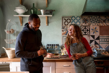Laughing couple at kitchen