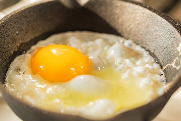 Close-up of fried eggs in a frying pan