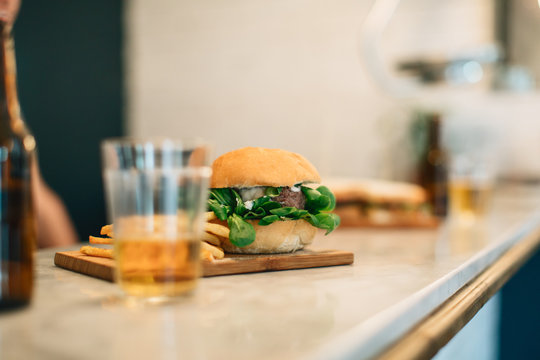 Burger with french frites in a restaurant.