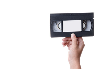 Hand holding old analog VHS Video Cassette Tape
