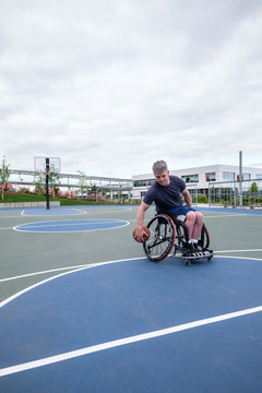 Active Disabled Athlete Practicing Wheelchair Basketball