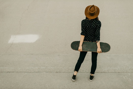 Woman with Skateboard