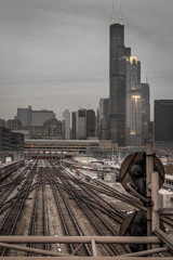 Vertical shot of railroad tracks and Chicago skyline