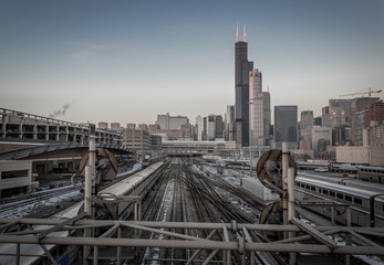 Looking down railroad tracks to the Chicago skyline