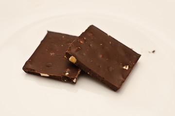 Stack of dark chocolate with almond pieces