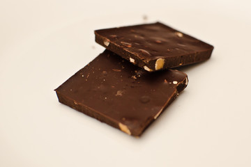 Closeup of two stacked pieces of chocolate