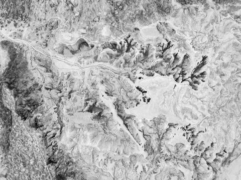 black and white image of rugged desert landscape from above, queshm island, iran