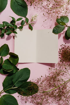 White greeting card with plants and flowers