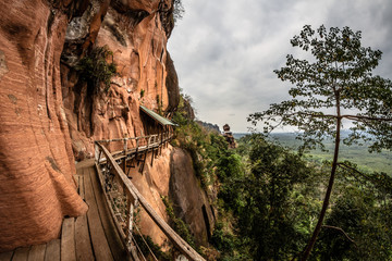 Amazing wooden pathway at Wat Phu Tok temple, Thailand, dangerous and dizzying walkway 