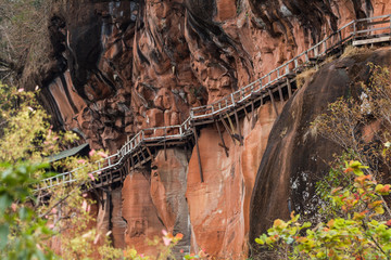 Amazing wooden pathway at Wat Phu Tok temple, Thailand, dangerous and dizzying walkway 