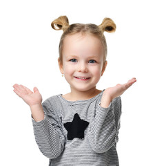 2470390 Young happy girl show something with hands for text copy space