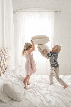 Twin Siblings Playing Pillow Fight
