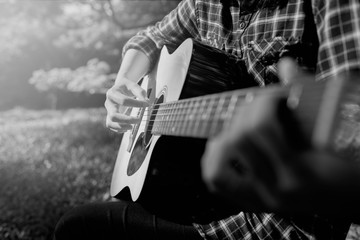 woman playing guitar.