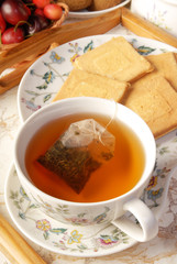 Tea bag in the cup with hot water 