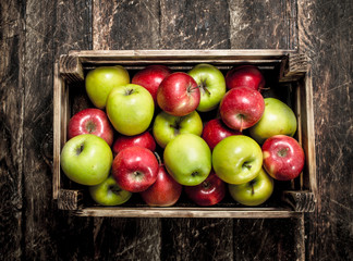 box with fresh red and green apples.