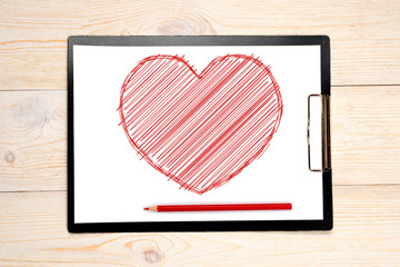 red sketched heart drawn on paper