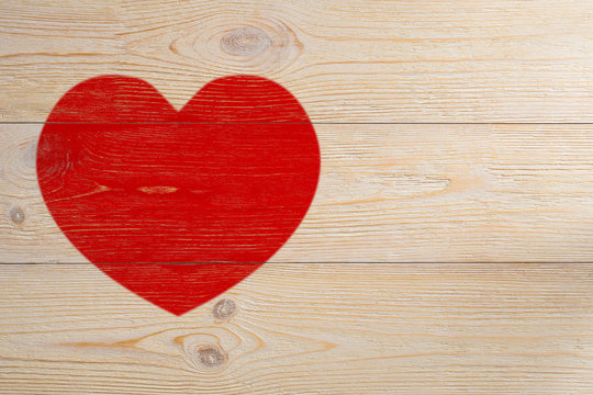 red heart painted on white rustic wooden planks