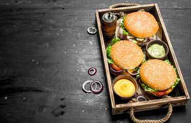 Burgers on an old tray.