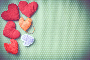 Valentine's Day. Colorful knitted hearts. Valentines day. Heart pendant. Vintage background in...