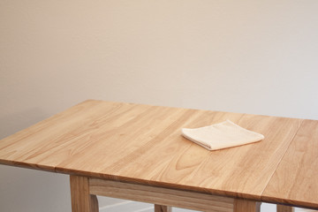 Cleaning a table for home maintenance and housekeeping with a cloth