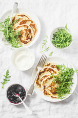 Gluten free chickpea pancake and arugula. Healthy diet breakfast or snack on white background, top view