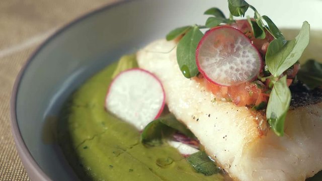 beautifully decorated dish of fish in a restaurant